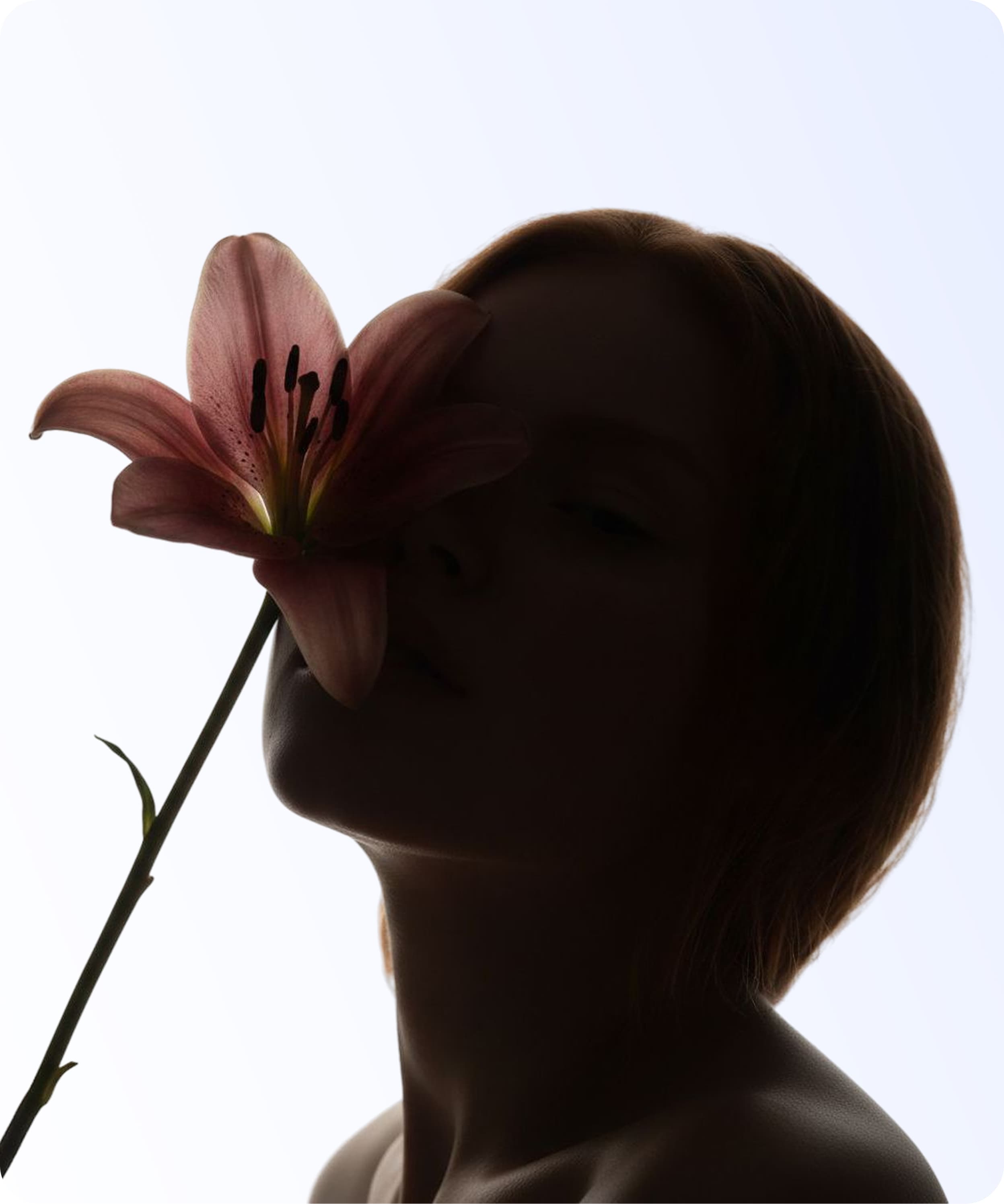 Woman smelling a flower, representing the sensory experience libido affects