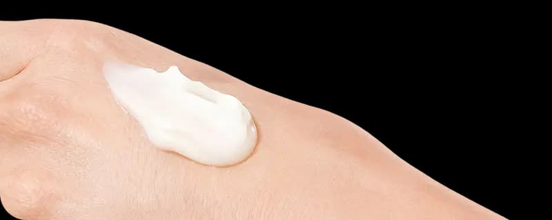 Cream on a person's hand
