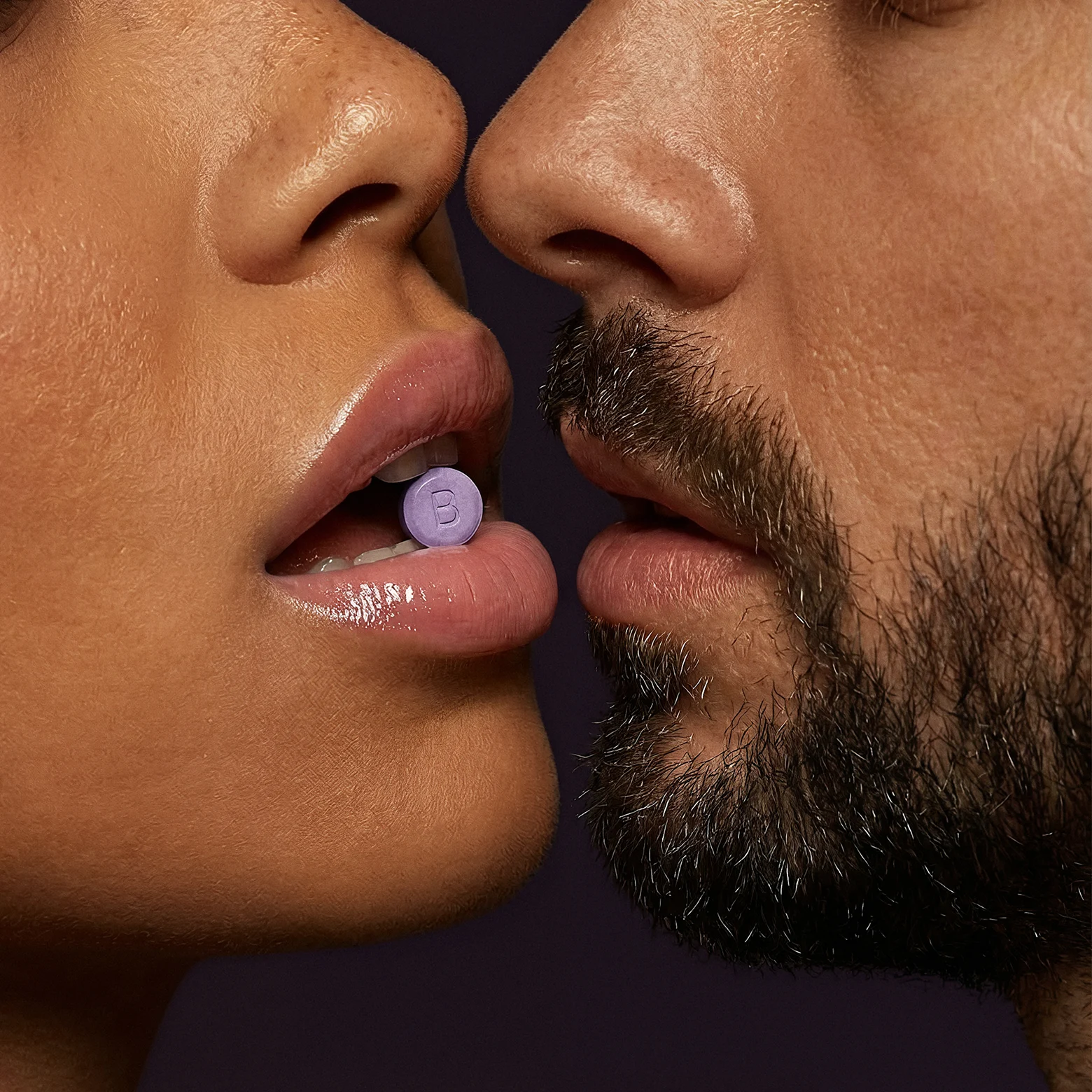 Woman placing a Libida sublingual tablet under her tongue